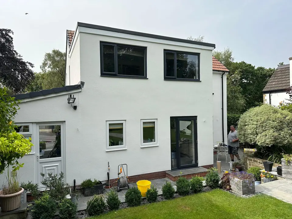 Front of a detached house after a crisp white render finish