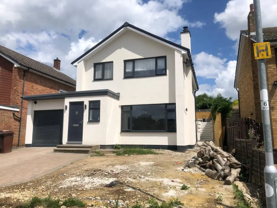 Modern detached house finished in white render