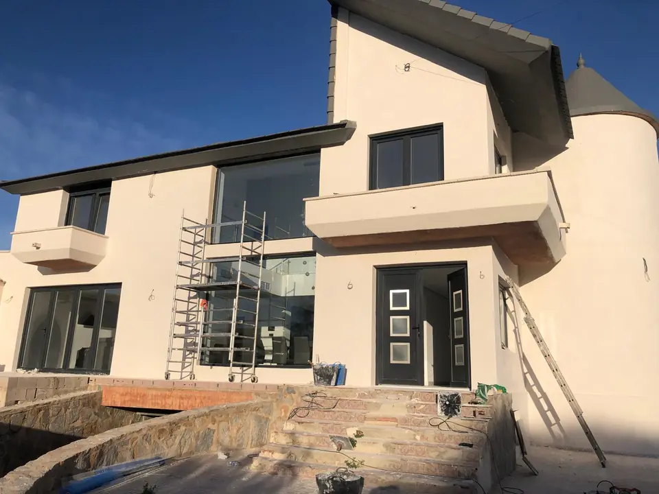 Villa in Spain with a finished external render in evening light